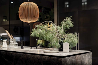 A modern kitchen countertop made of elegant natural stone with warm lighting.