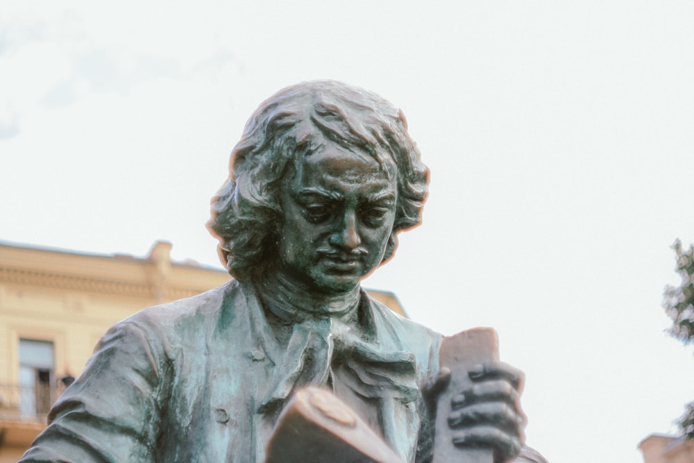 man in black leather jacket statue