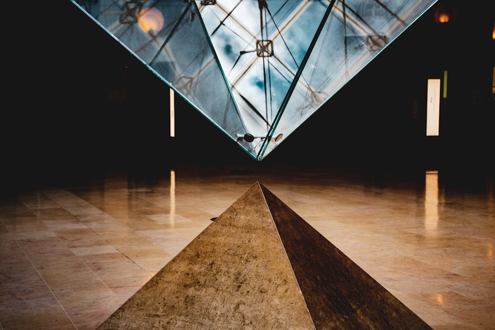 white and black umbrella on brown concrete floor