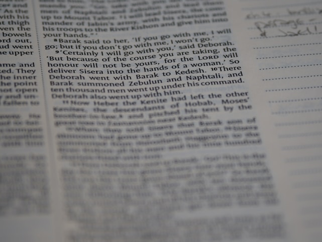 A close-up view of a page from a book, featuring clearly printed text on the left and faint handwritten notes on the right. The text discusses historical events and figures. The page is accompanied by lined sections for annotations.