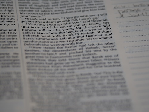 A close-up view of a page from a book, featuring clearly printed text on the left and faint handwritten notes on the right. The text discusses historical events and figures. The page is accompanied by lined sections for annotations.