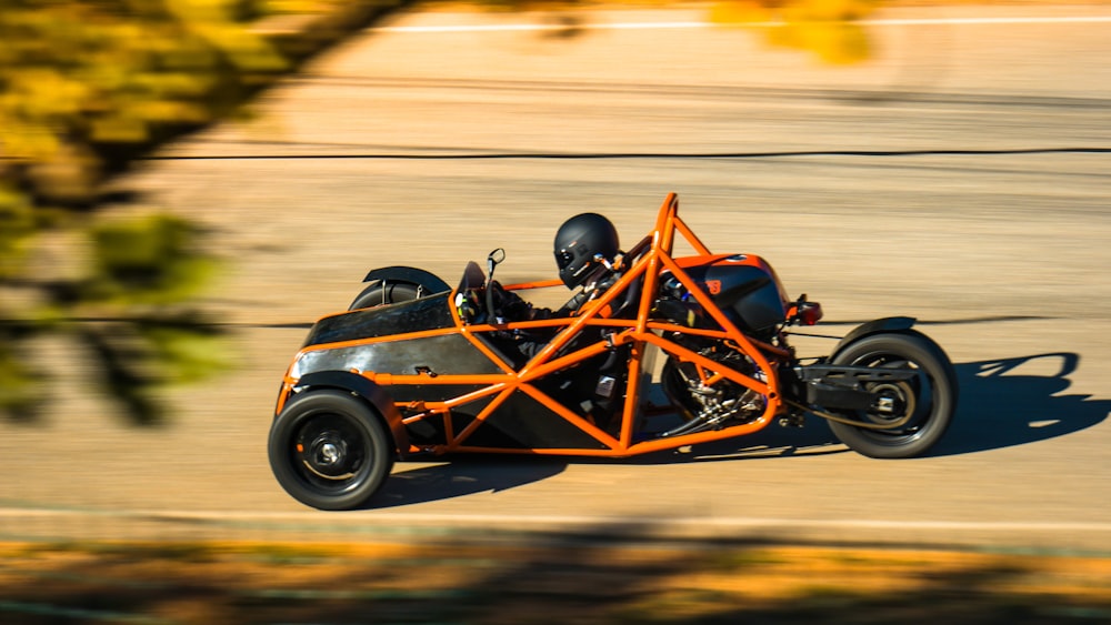 blue and black f 1 car on road