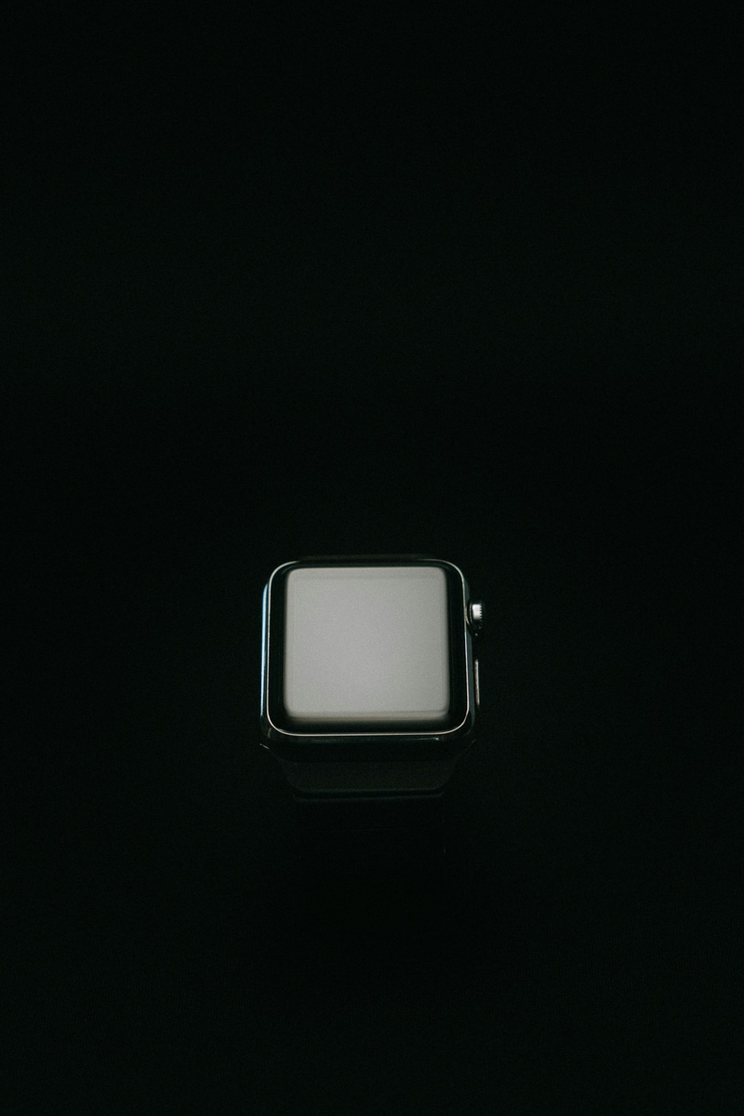 silver apple watch with white sport band