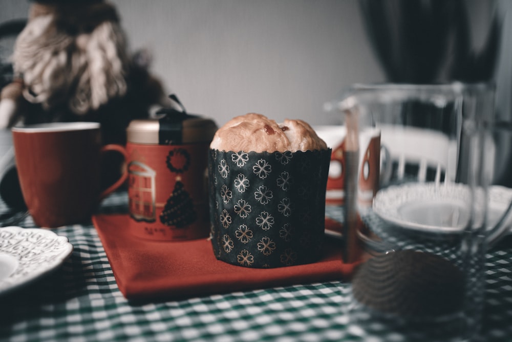 black and white ceramic mug on red tray