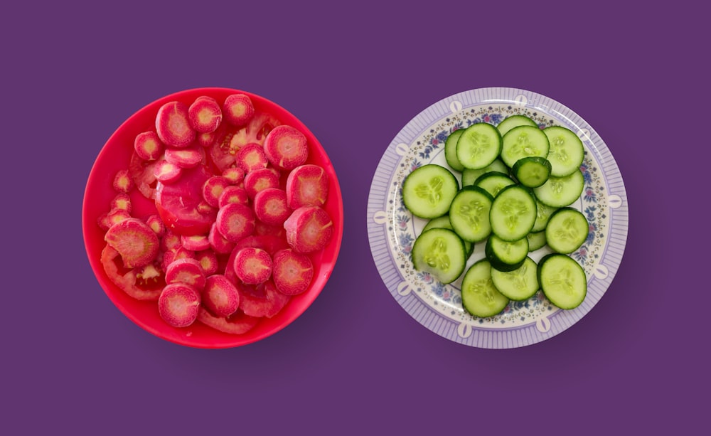 sliced cucumber and tomato on red round ceramic plate