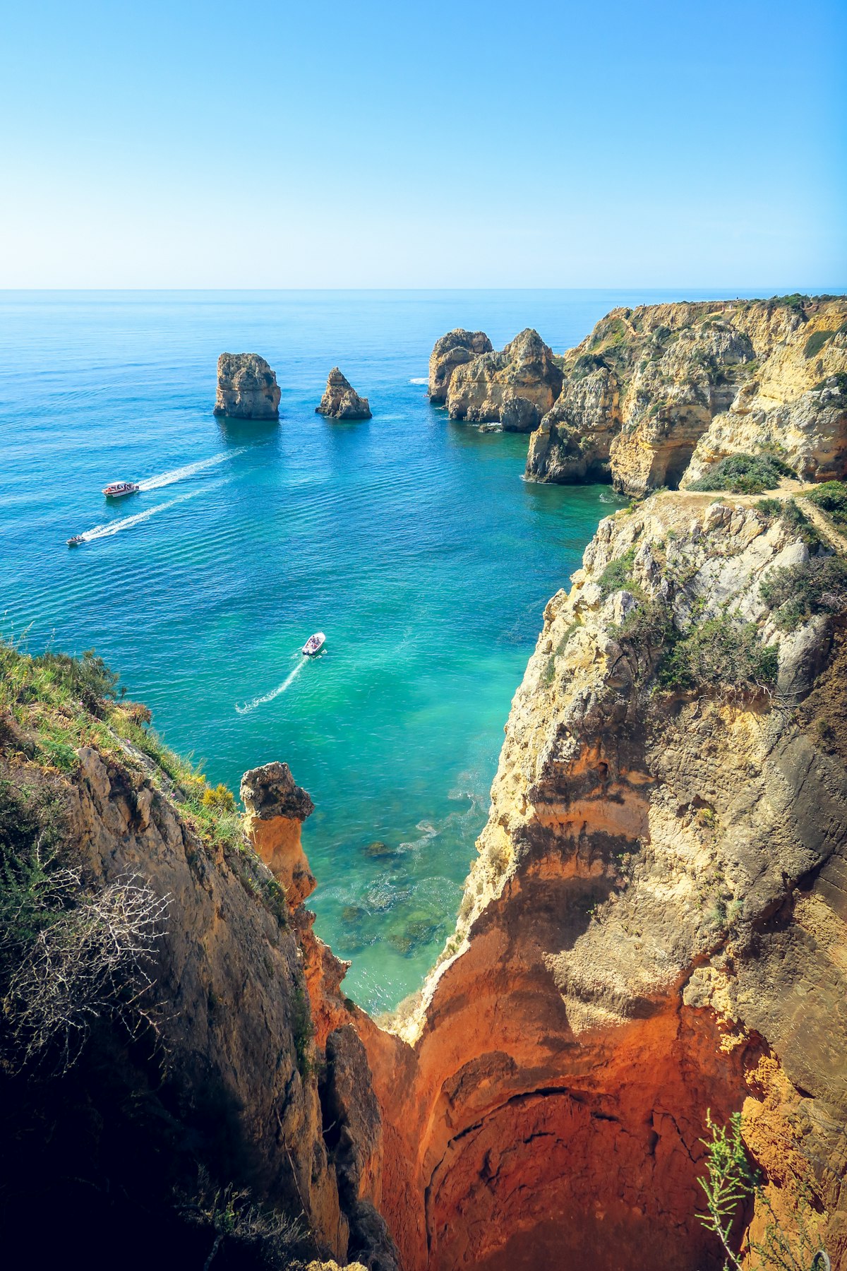 Dramatic golden cliffs and blue sea at Ponta da Piedade, Algarve Portugal