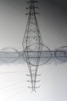 black electric tower under white sky