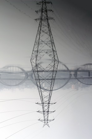 black electric tower under white sky