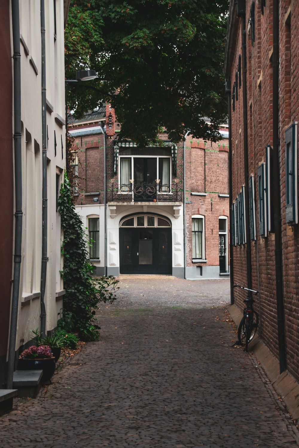 brown brick building with black metal gate