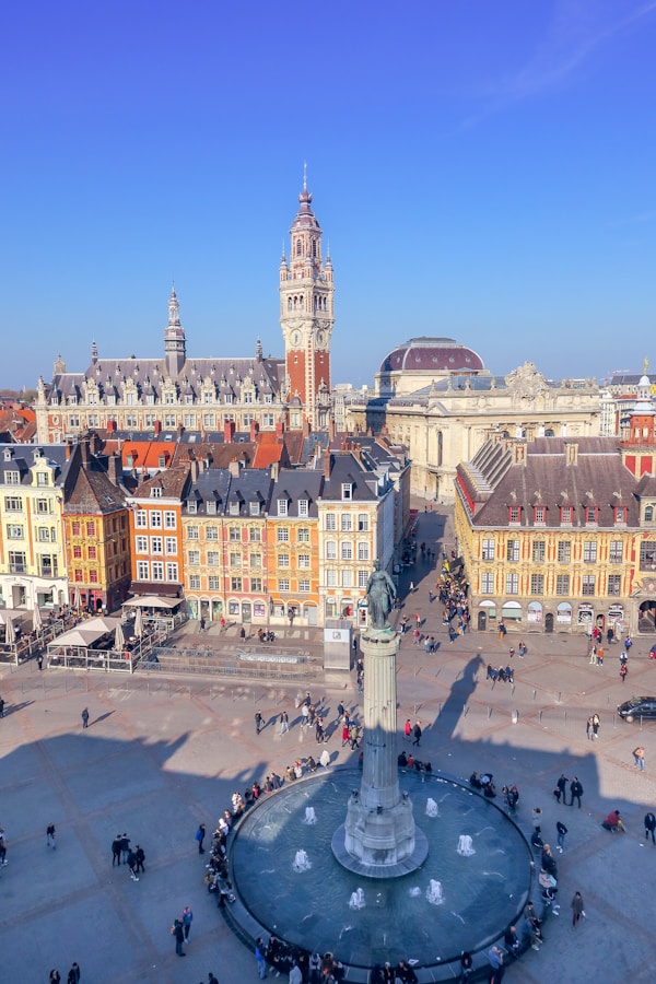 View of the main square in Lille, in the city center in the north of France. The buildings are colorful and the architecture typical of the region.by Max Zed