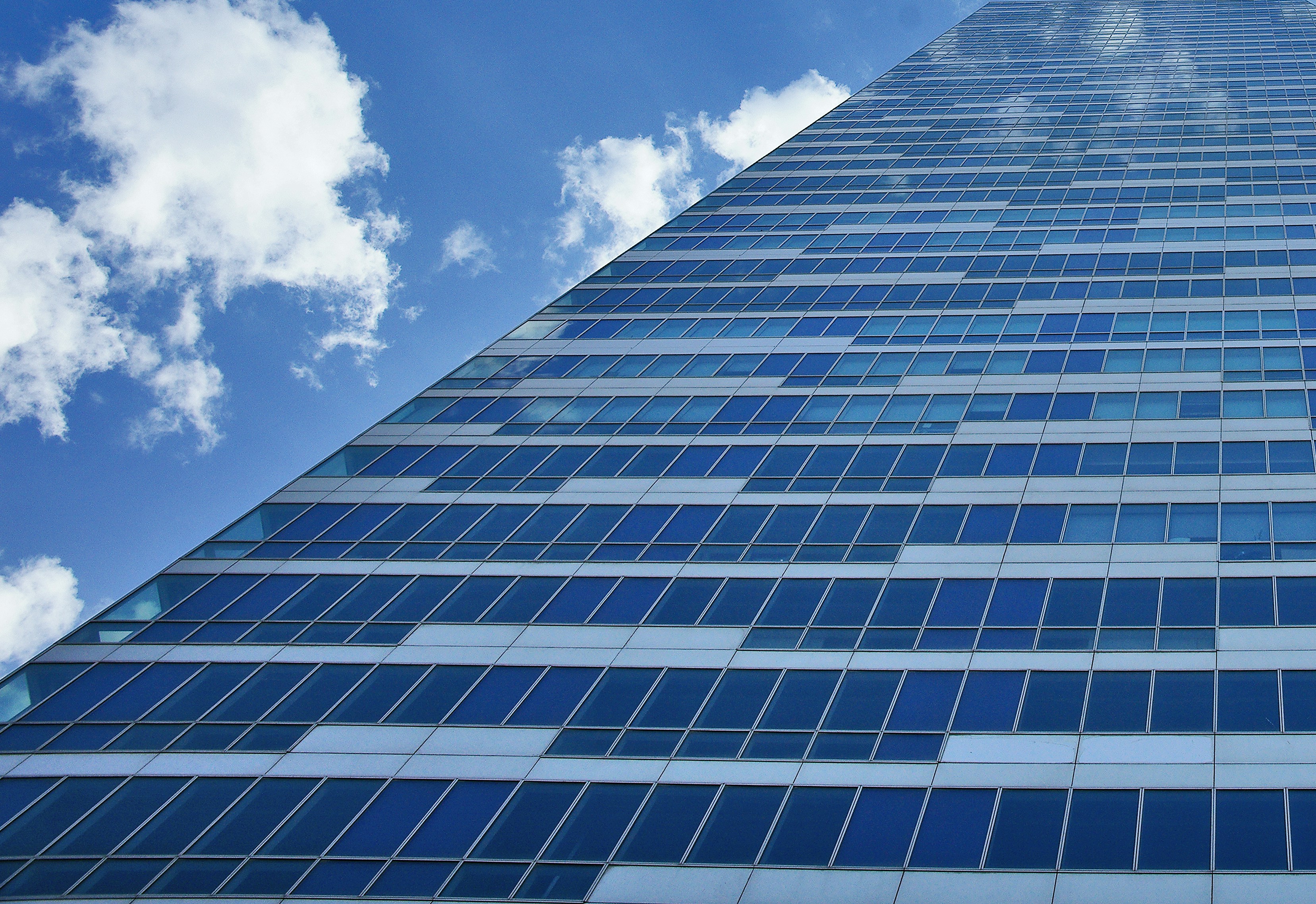 white and blue concrete building under blue sky during daytime