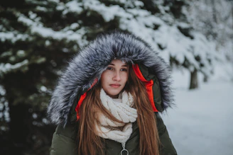 woman in green parka jacket and white shirt