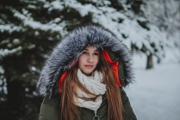 woman in green parka jacket and white shirt