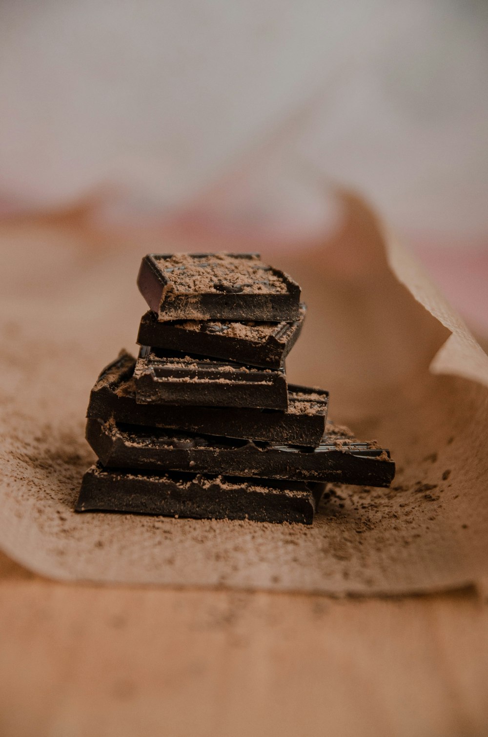 black chocolate bars on white sand