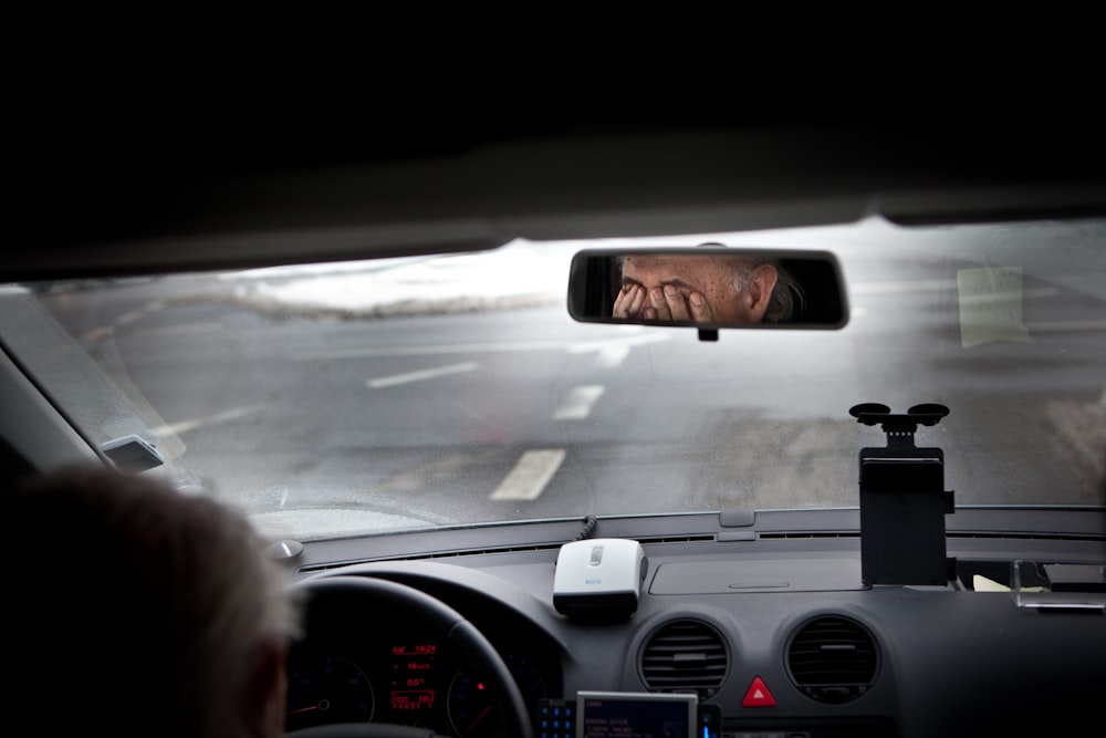 person driving car during daytime