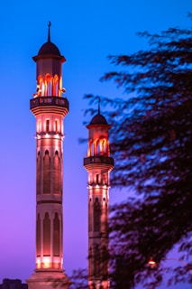 brown and black concrete building under blue sky