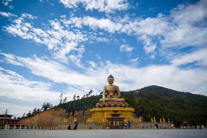 Gold Buddha statue under open sky