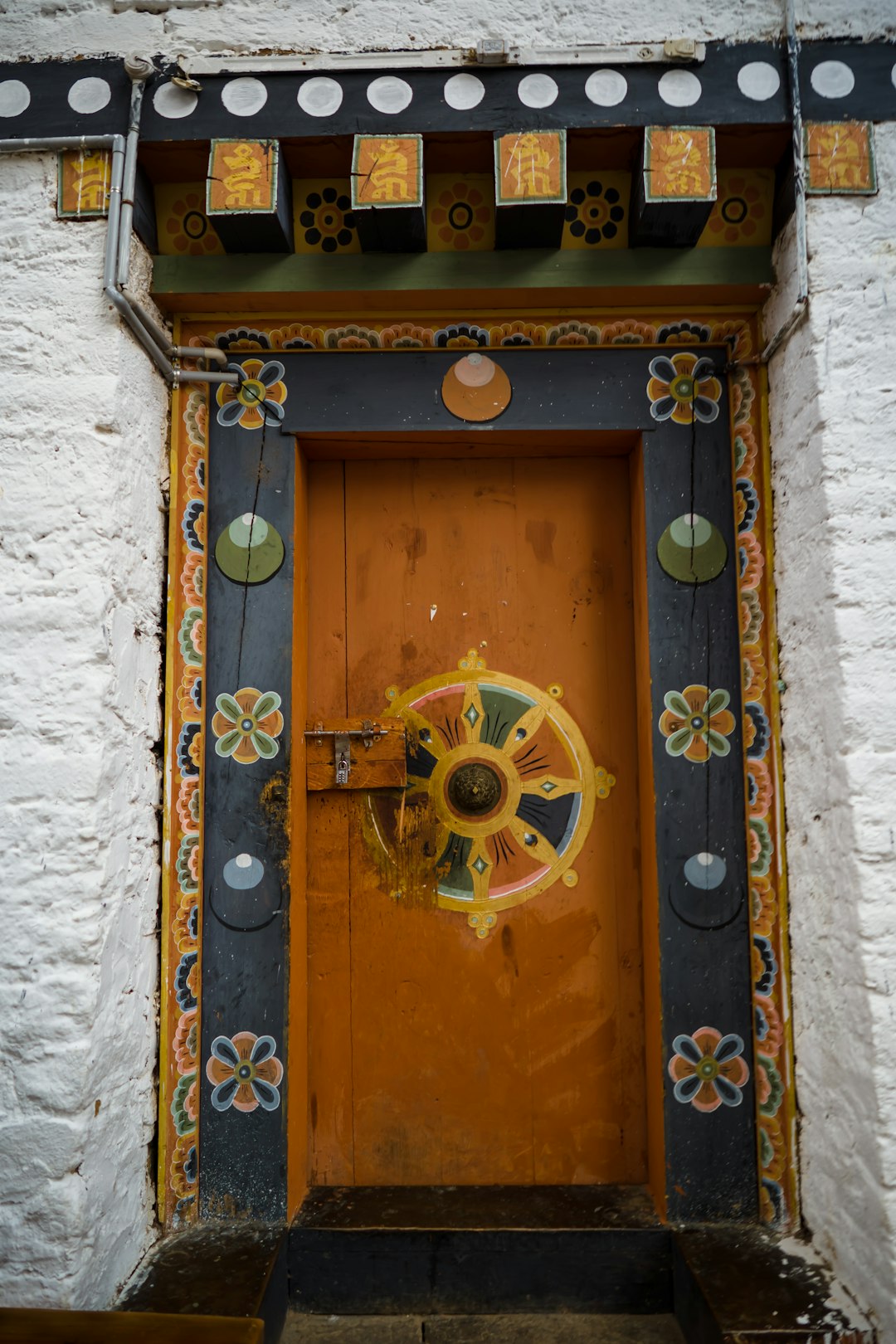 brown wooden door with yellow and black door lever