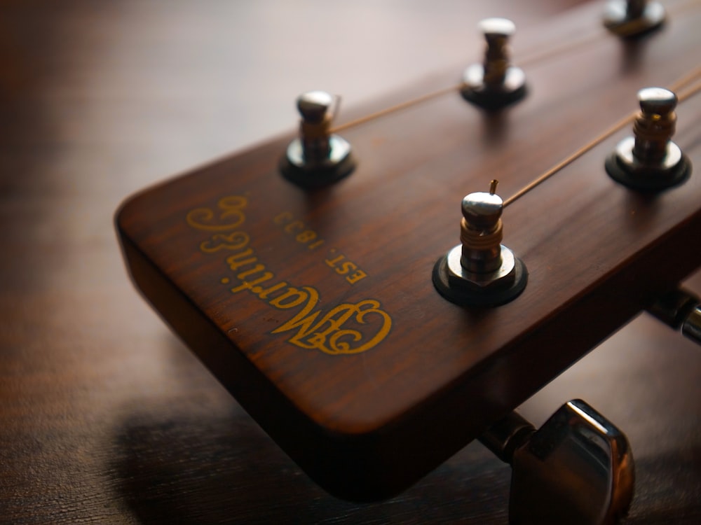 brown guitar pick on brown wooden table