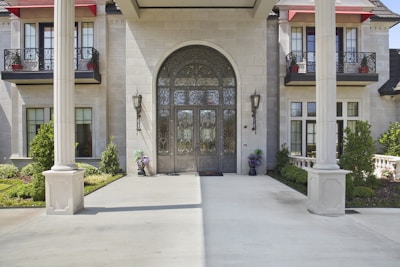 Grand entrance gate of Godrej Majesty with modern architecture and lush landscaping