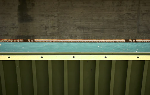 High-resolution photo showing detailed close-up of hybrid reinforced concrete bending model in laboratory setting