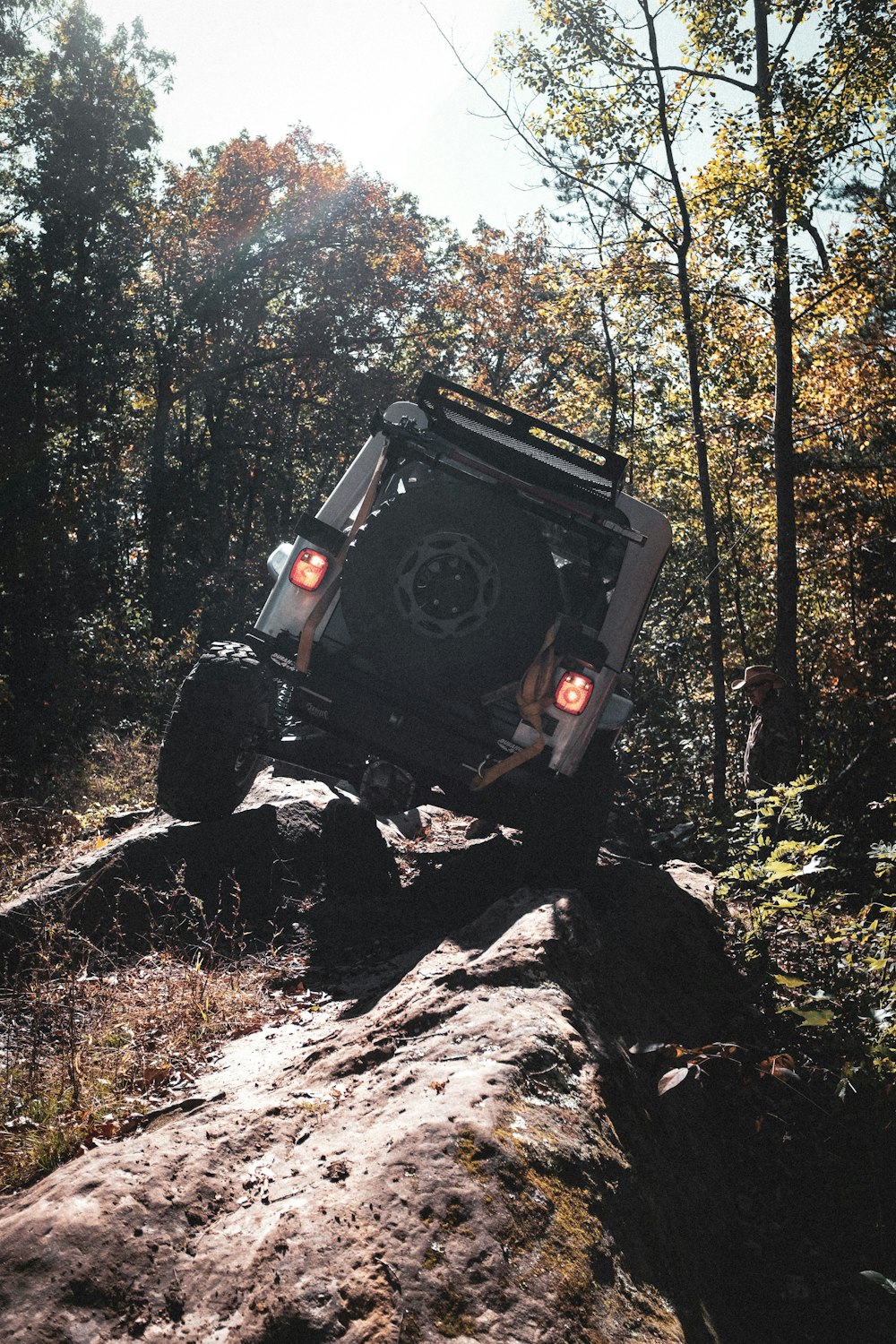 black jeep wrangler on rocky road