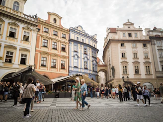 people walking on street near brown concrete building during daytime