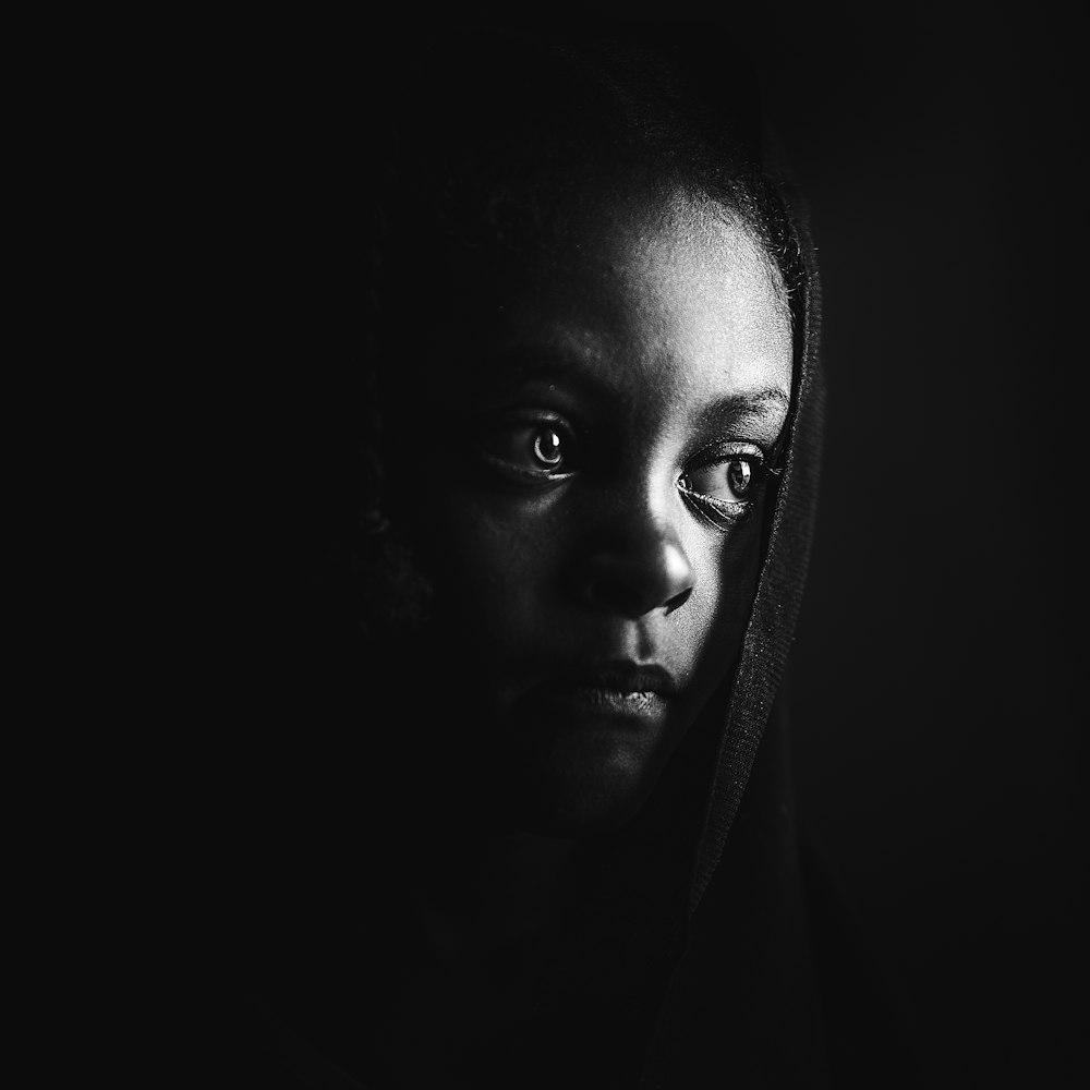 grayscale photo of womans face