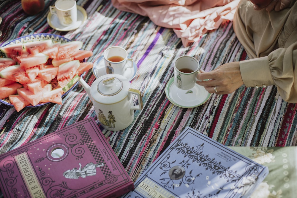 white ceramic mug on pink and white table cloth