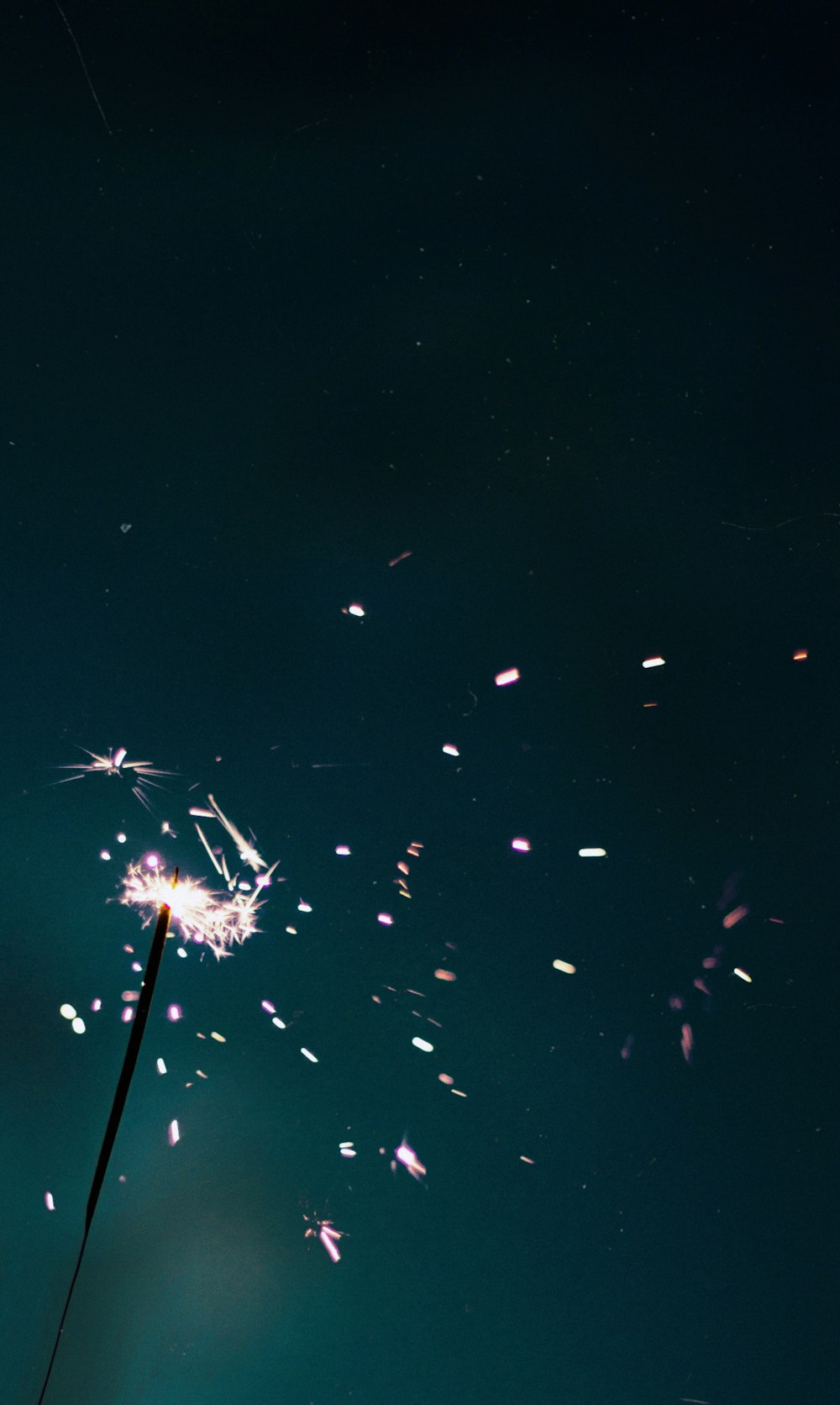 white and blue fireworks in the sky