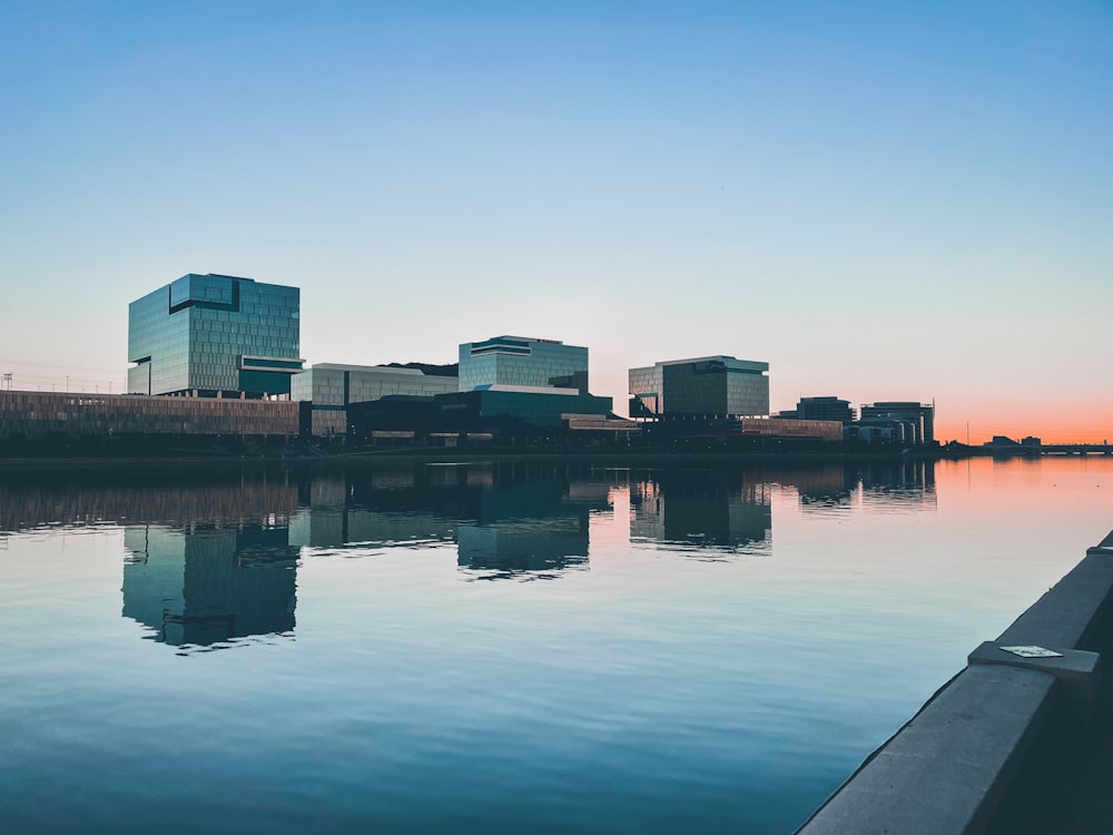 brown concrete building near body of water during daytime