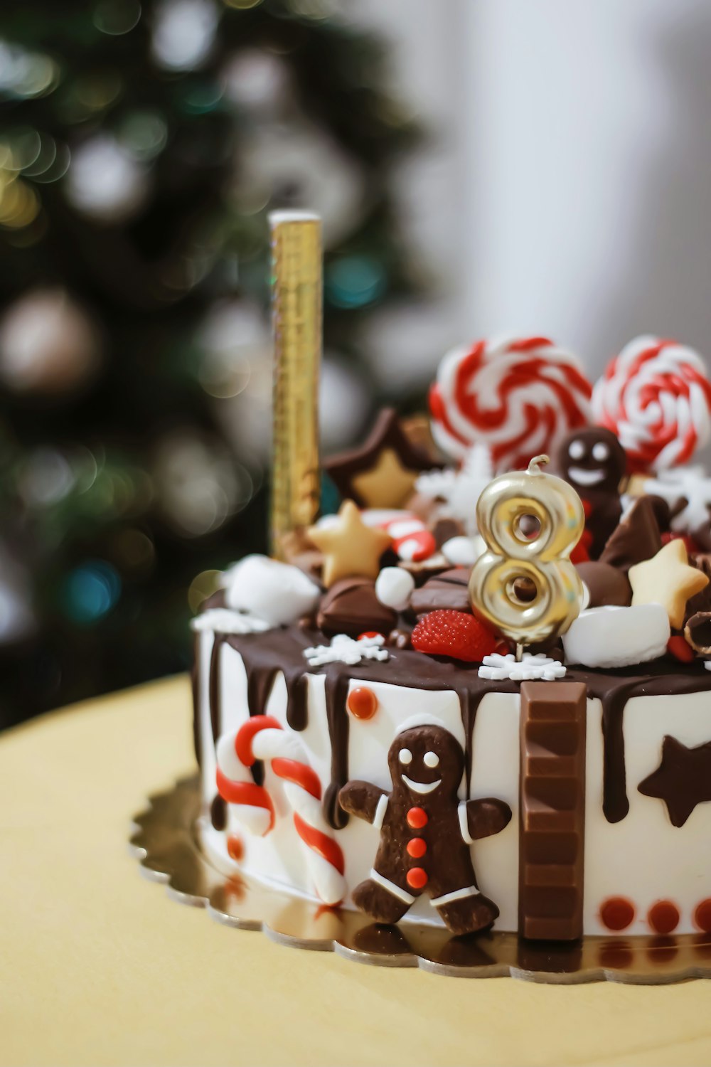 white and brown cake with red and white icing on top