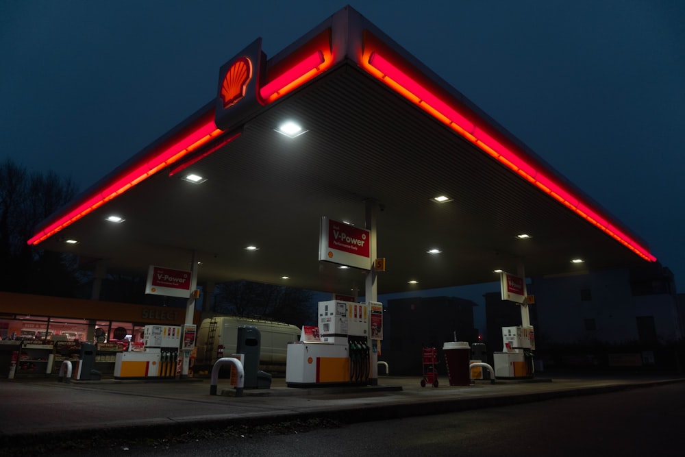 red and white store front during night time