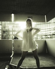 A determined entrepreneur standing tall with a golden light shining behind.