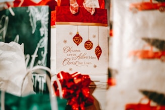 Close-up of a Christmas card featuring shimmering gold foil embossing highlighting holiday motifs.