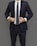 A professional lawyer in a dark blue suit giving a consultation.