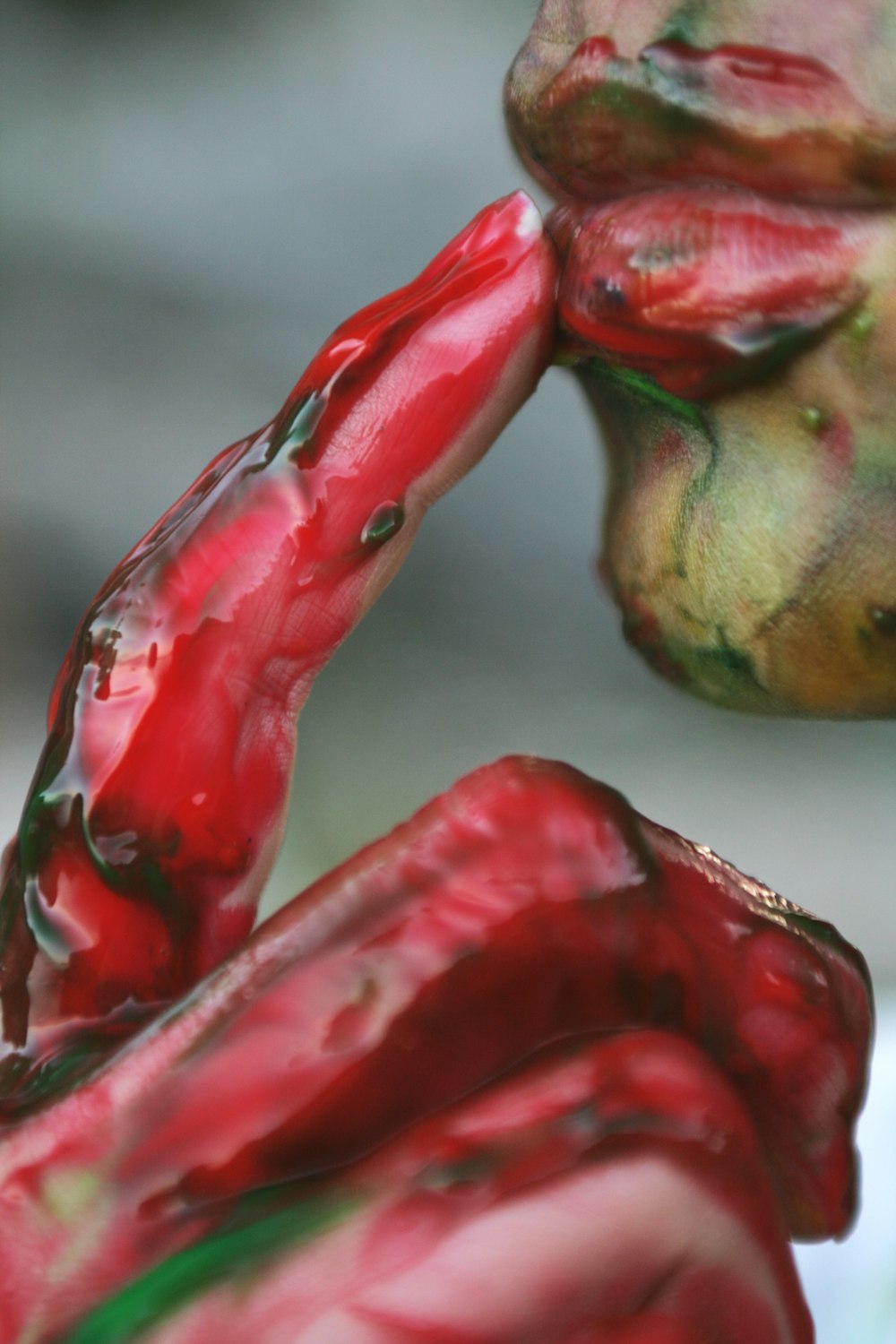 red and green ceramic figurine