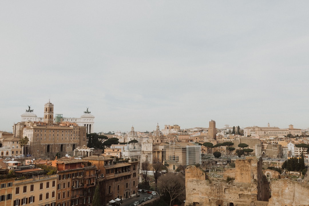 brown concrete buildings under white sky during daytime, Italian Skyline<p></figure>By @wazzastudio