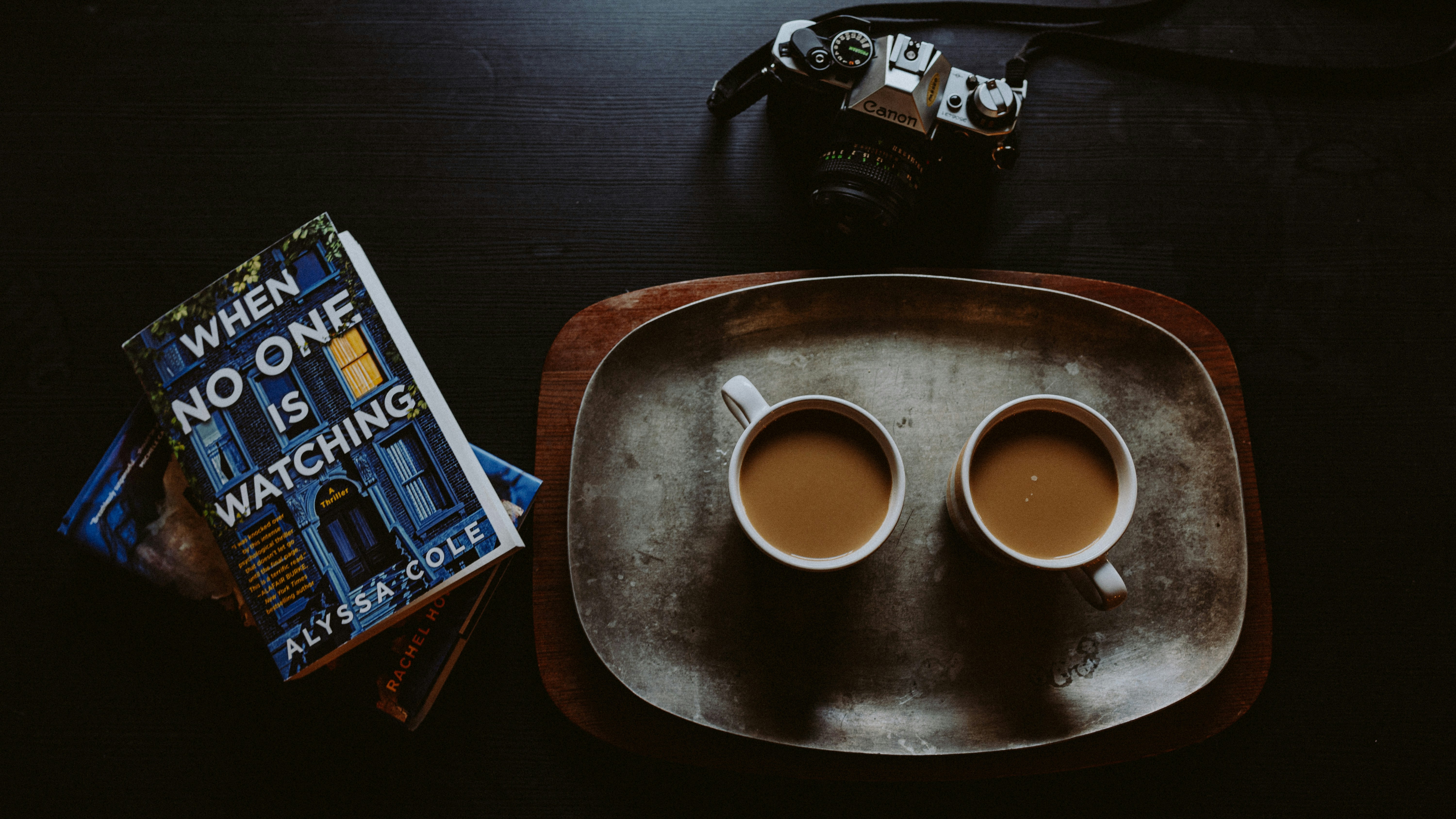 black and white ceramic mug on brown wooden table
