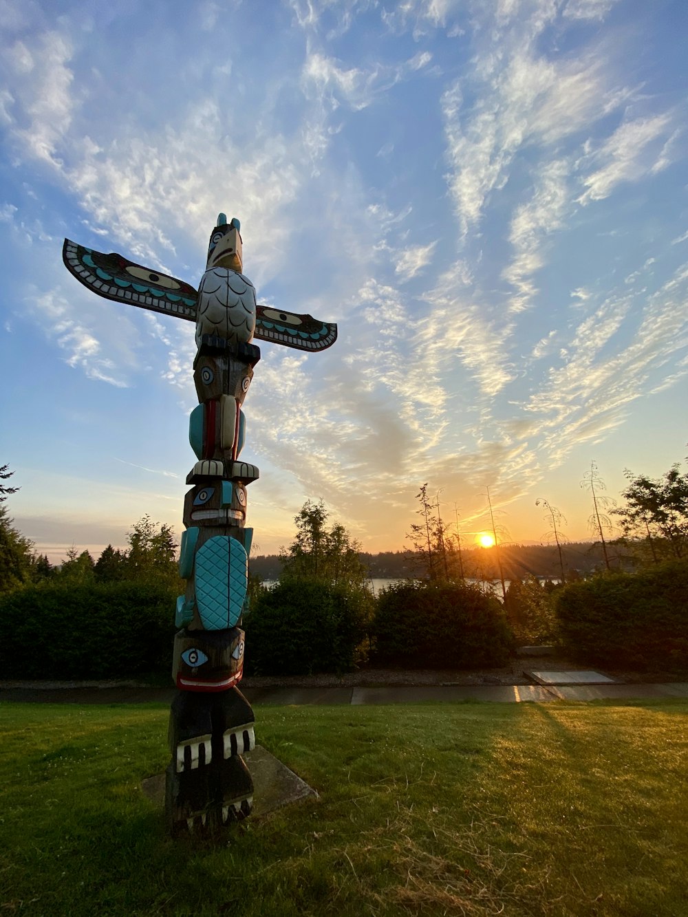 brown and white wooden statue under blue sky during daytime