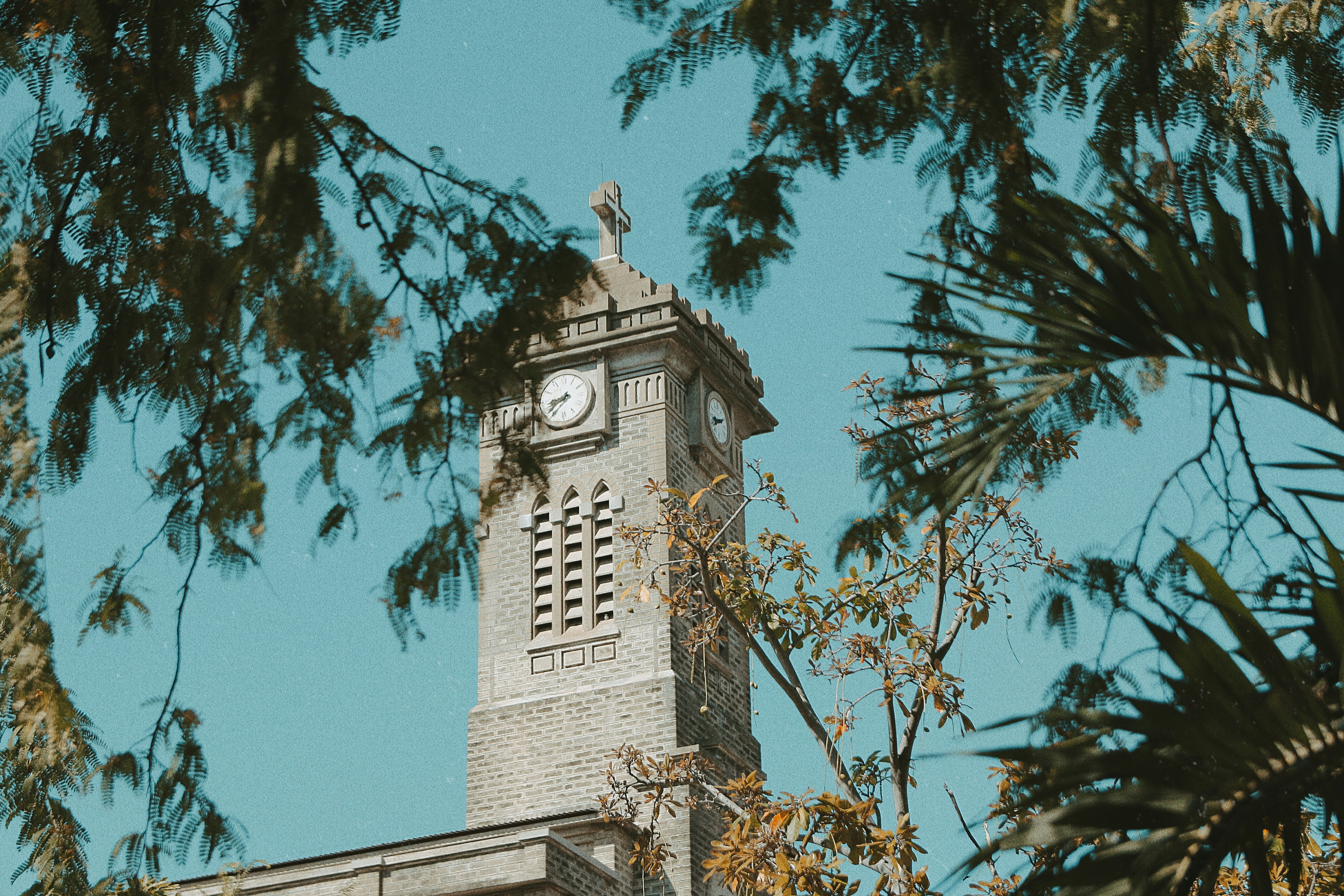brown concrete tower with clock