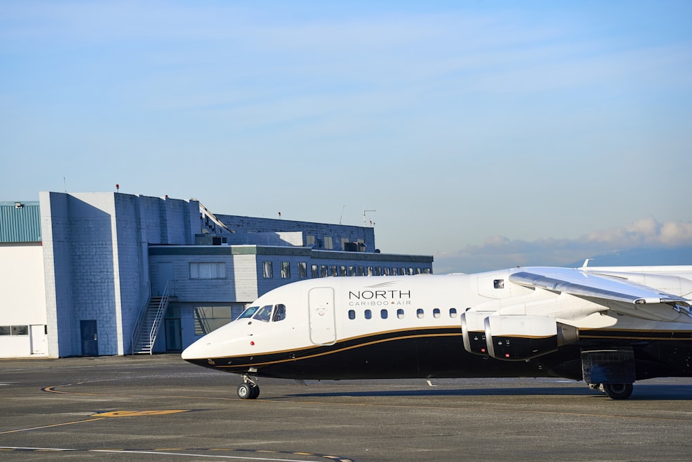 white passenger plane on airport during daytime