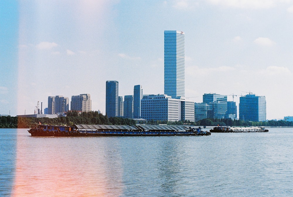 city skyline across body of water during daytime