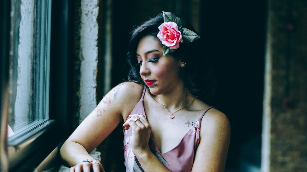 Woman wearing flowers as a photography prop in a natural portrait setting