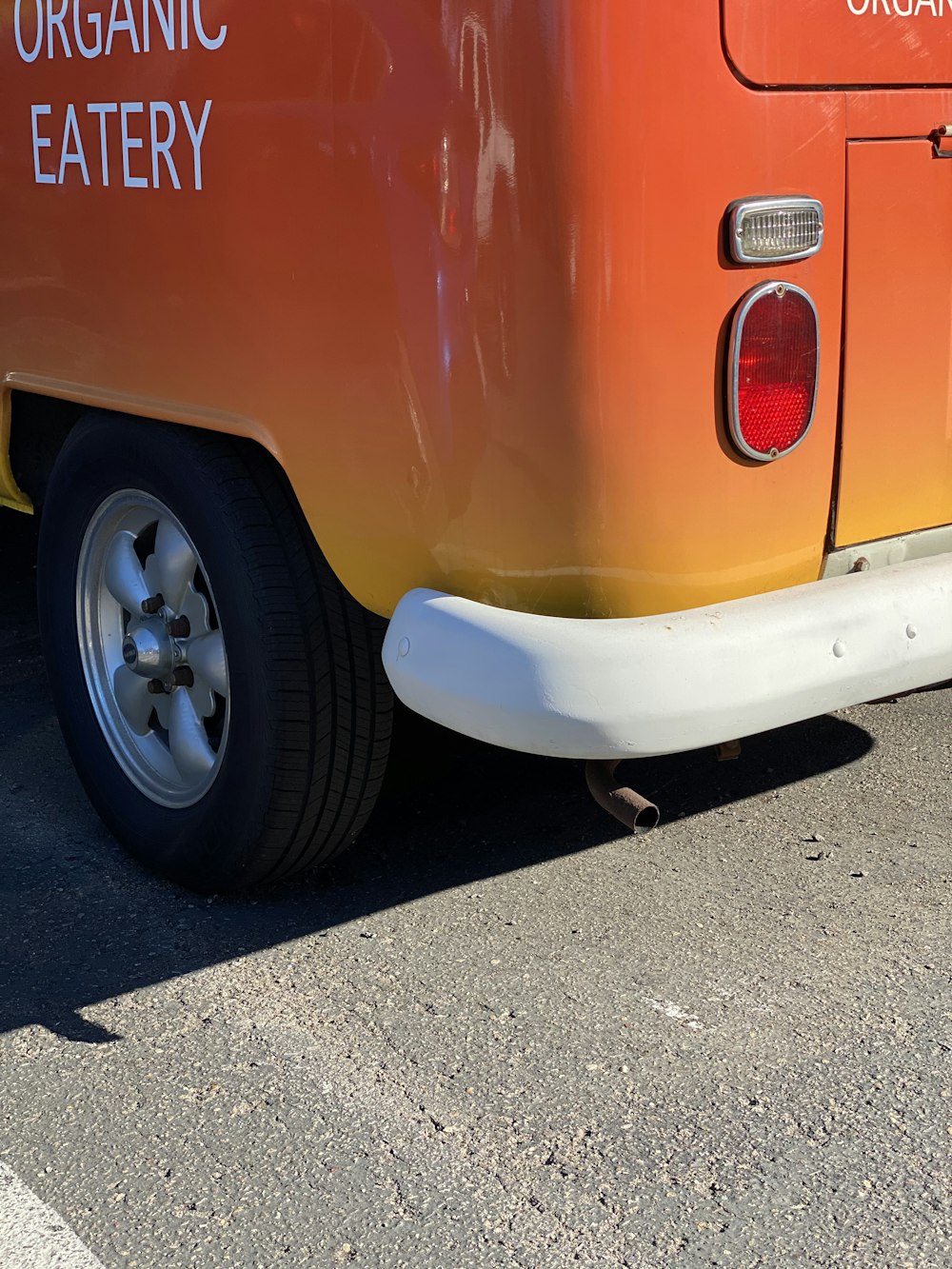 orange car with gray wheel and tire