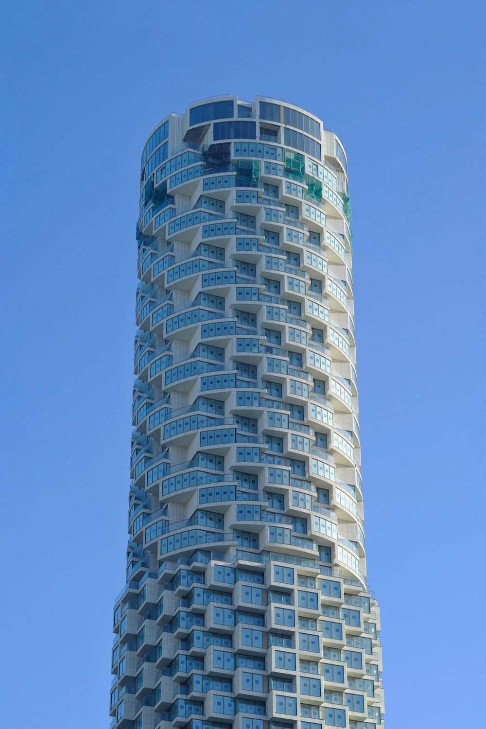 white and black concrete building under blue sky during daytime