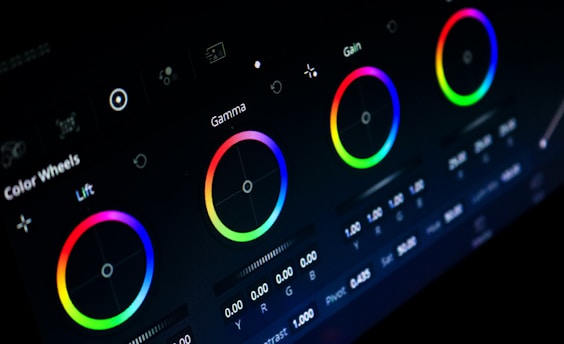 A color grading workstation with color wheels and monitors.