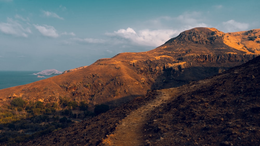 brown mountain under blue sky during daytime