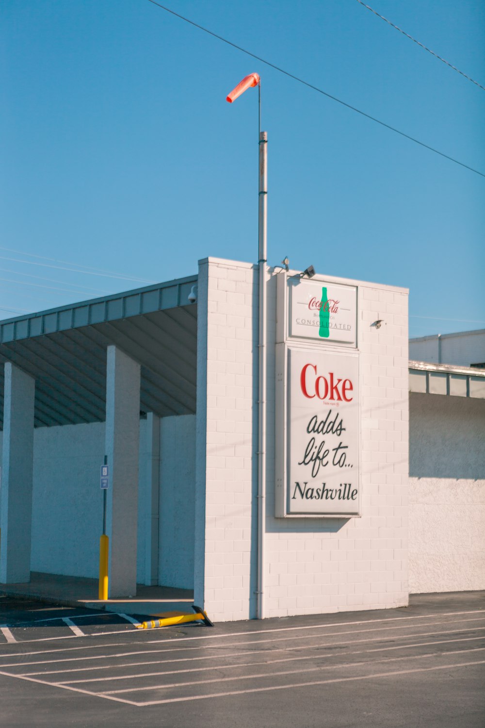 a white building with a flag on top of it