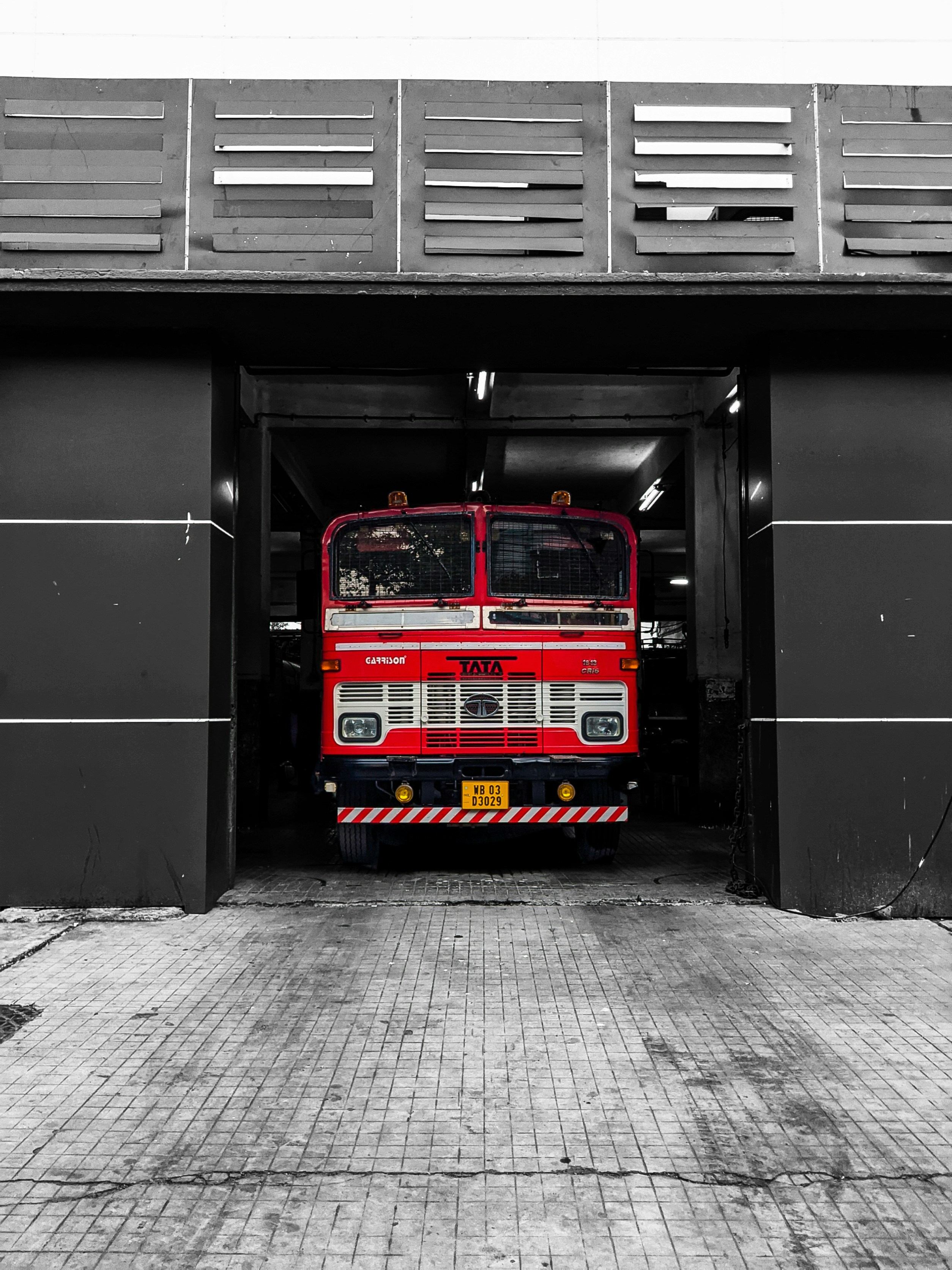 red blue and yellow bus in a tunnel